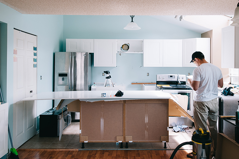 Kitchen remodel with kitchen cabinets painted.