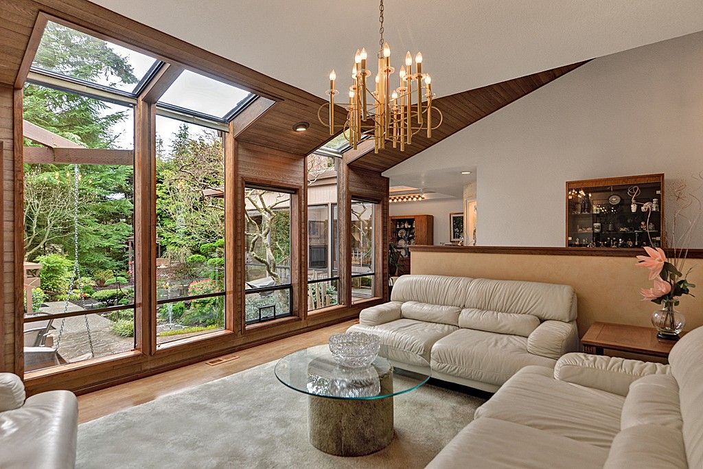 Modern home with large beige area rug.